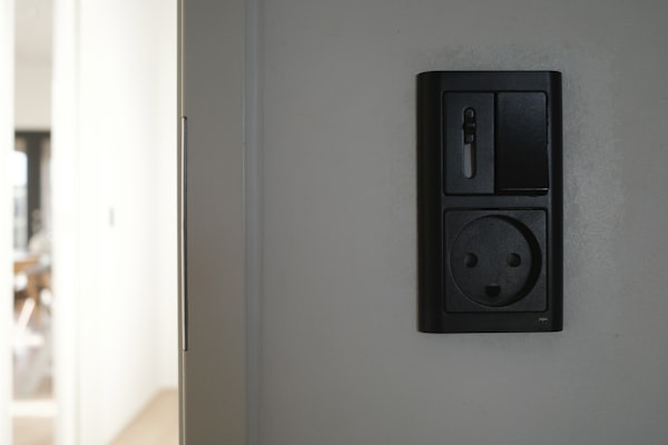 Electrical outlet and switch on wall